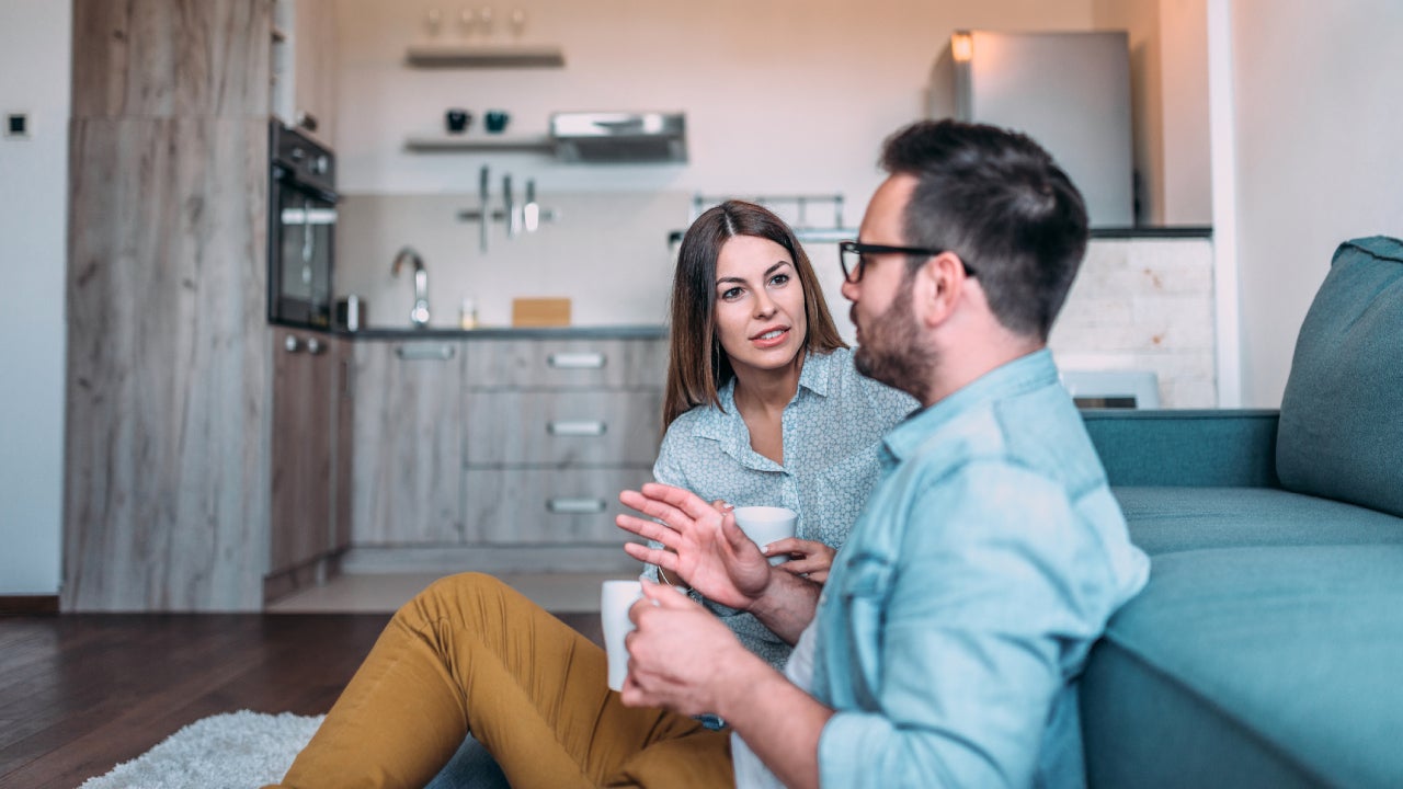 Two people having coffee and talking
