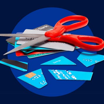 Design element displaying credit cards being cut up with a pair of scissors.
